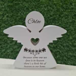 Personalised wooden memorial angel painted white with engraved message and cut-out heart.
